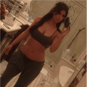 photo of kim kardashian selfie in sports bra and sweats in bathroom