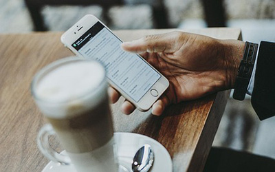 Coffee, hand holding smartphone, image by Pexels from Pixabay.