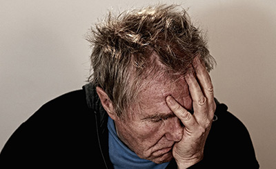 a man with hand in his hand, showing shame for porn hypnosis, featured image by Gerd Altmann from Pixabay.